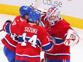 Canadiens David Savard and Nick Suzuki congratulate goalie Sam Montembeault following their team's victory over the Nashville Predators in of National Hockey League game in Montreal Thursday January 12, 2023.