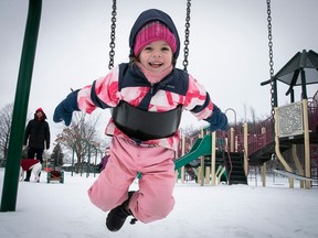 Four year-old Klara Gavrilovic is all bundled up as she enjoys the swings at Centennial park in D.D.O. Jan. 8, 2023.