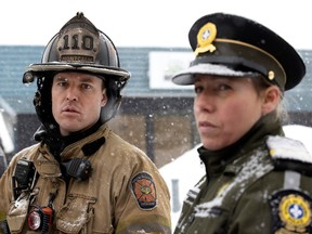 Fire chief François Thivierge and SQ officer Éloïse Cossette speak to the media after an explosion at a propane-distribution company in St-Roch-de-l'Achigan on Thursday, Jan. 12, 2023.