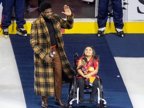 Former Montreal Canadien P.K. Subban brought his friend Mila out onto the ice for a tribute to his career prior to National Hockey League game against the Nashville Predators in Montreal Thursday Jan. 12, 2023.