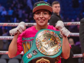 Mexico’s Yesica Nery Plata shows off her championship belt following her WBA/WBC unification bout win over Quebecer Kim Clavel at the Place Bell Sports Complex in Laval on Friday, Jan. 13, 2023.