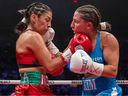 Yesica Nery Plata, left, trades punches with Montreal's Kim Clavel during unification bout at the Place Bell in Laval on Jan. 13, 2023.