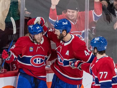 Montreal Canadiens left wing Mike Hoffman, left, is congratulated by Canadiens defenceman Joel Edmundson, centre, and Canadiens centre Kirby Dach, right, after scoring against the Winnipeg Jets during 2nd period NHL action at the Bell Centre in Montreal on Tuesday Jan. 17, 2023.