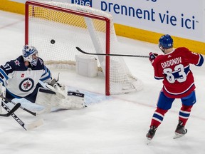 Montreal Canadiens right wing Evgenii Dadonov (63) pots an easy goal against Winnipeg Jets goaltender Connor Hellebuyck (37) during 2nd period NHL action at the Bell Centre in Montreal on Tuesday Jan. 17, 2023.
