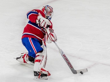 Montreal Canadiens goaltender Sam Montembeault (35) clears the puck from the zone against the Winnipeg Jets during 2nd period NHL action at the Bell Centre in Montreal on Tuesday Jan. 17, 2023.