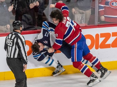 Montreal Canadiens defenceman Arber Xhekaj (72) and Winnipeg Jets centre Adam Lowry (17) fight in the dying minutes of a 4-1 Canadiens win over the Jets at the Bell Centre in Montreal on Tuesday Jan. 17, 2023.