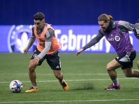 CF Montréal's Joaquin Torres, left, and Samuel Piette during practice at the Olympic Stadium on Jan.  18, 2023.