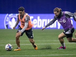CF Montréal's Joaquin Torres, left, and Samuel Piette during practice at the Olympic Stadium on Jan. 18, 2023.