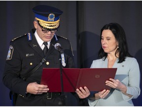 Fady Dagher reads oath with Mayor Valérie Plante as he is sworn in as Montreal police chief on Thursday, Jan. 19, 2023.