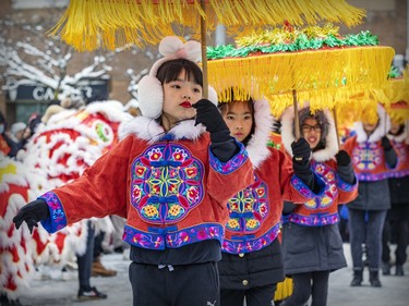 Members of the Phoenix Artistic Troupe dance in the Lunar New Year parade in Montreal's Chinatown on Saturday, Jan. 21, 2023.