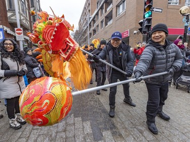 Dragon dance makes its way through Montreal's Chinatown during the Lunar New Year parade on Saturday, Jan. 21, 2023.