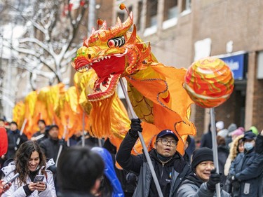 Dragon dance makes its way through Montreal's Chinatown during the Lunar New Year parade on Saturday, Jan. 21, 2023.