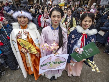 Members of the Tsingher Association wear traditional Nan Fu attire while walking in the Lunar New Year parade in Montreal's Chinatown on Saturday, Jan. 21, 2023.