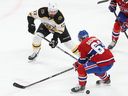 Montreal Canadiens' Evgenii Dadonov (63) looks back at the puck with Boston Bruins' Nick Foligno (17) comes into the play during first period NHL action in Montreal on Tuesday January 24, 2023.