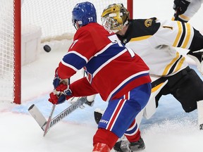 Montreal Canadiens centre Kirby Dach scores his second goal of the night on Boston Bruins goaltender Jeremy Swayman, during the third period in Montreal on Jan. 24, 2023.
