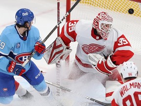 Montreal Canadiens' Rafael Harvey-Pinard scores on Detroit Red Wings goaltender Ville Husso during second-period action in Montreal on Thursday, Jan. 26, 2023.