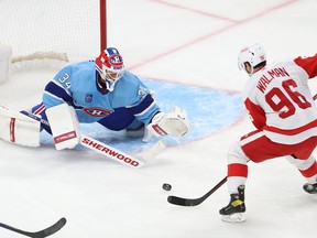 Detroit Red Wings' Jake Walman shoots on Montreal Canadiens' Jake Allen during second period in Montreal on Jan. 26, 2023.