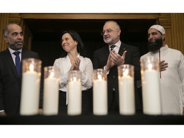Montreal Mayor Valérie Plante stands with Samer Majzoub, president of the Canadian Muslim Foundation, left, Aref Salem, leader of the opposition, and Iman Imran Shariff at city hall on Friday, Jan. 27, 2023, to commemorate the Quebec city mosque killings of 2017.