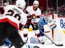 Canadiens goaltender Jake Allen keeps his eye on the play as Senators' Derick Brassard parks in front of the net while veteran Claude Giroux looks on.  at the Bell Center Tuesday night.