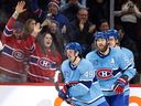 Habs fans cheer after Canadiens' left wing Rafaël Harvey-Pinard (49) tied the game 4-4 during the third period Tuesday night at the Bell Centre.