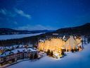 The ski-in-ski-out Fairmont Tremblant, the crown jewel of the resort's on-mountain village, radiates warmth in winter.