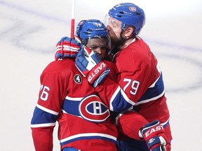 Montreal Canadiens defenceman P.K. Subban, left, celebrates his goal with Andrei Markov during second at the Bell Centre in Montreal on April 17, 2015.