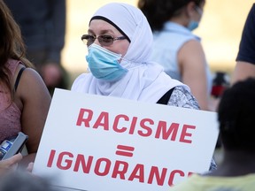 A woman takes part in a vigil in Montreal in June 2021. "Muslim Awareness Week, which starts Wednesday, is one step toward a better, more inclusive future," Samaa Elibyari writes.