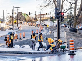 Construction crews work at the intersection of Remembrance Rd. and Côte-des-Neiges Rd. in Montreal on Nov. 8, 2022.
