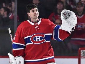Carey Price in Habs gear waves to fans from the ice.