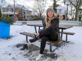 Erin Tedford puts her boots back on after a skate in Pointe-Claire on Dec. 1, 2021. Tedford resigned this week, reporting that she had been subjected to abusive behaviour and saying she is concerned about "a disturbing level of anger and division" in the Montreal suburb.