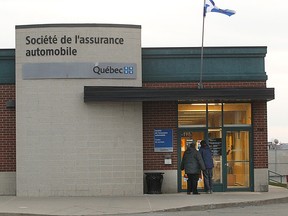 Customers enter a SAAQ service centre in 2014.