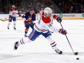Canadiens' Nick Suzuki takes the first period shot against the New York Islanders at the UBS Arena on Saturday, Jan. 14, 2023, in Elmont, N.Y.
