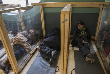 Resilience Montreal client Michel Chiasson sits in the sleeping quarters of the shelter on Dec. 12, 2022.