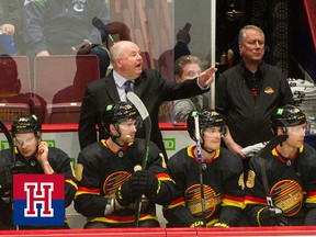 Bruce Boudreau behind the Vancouver Canucks bench