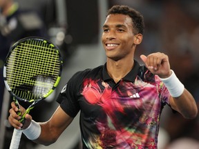 Montreal's Felix Auger-Aliassime celebrates after winning against Vasek Pospisil during their men's singles match on Day 1 of the Australian Open tennis tournament in Melbourne Jan. 16, 2023.