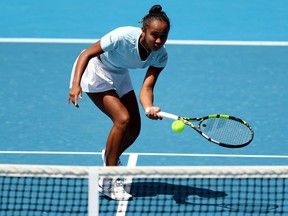 Canada's Leylah Fernandez hits a return against France's Alize Cornet during their women's singles match on day two of the Australian Open tennis tournament in Melbourne on January 17, 2023.