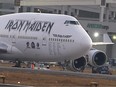 Ed Force One, the airliner of British heavy metal band Iron Maiden, is seen parked with its engines damaged after being hit by a tractor at the Santiago International Airport, March 12, 2016.
