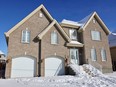 A home in Vaudreuil-Dorion on Jan. 16, 2023, where the bodies of two people were found by police the day before. (