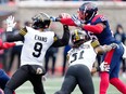 Montreal Alouettes linebacker Tyrice Beverette knocks the ball loose from Hamilton Tiger-Cats quarterback Dane Evans during first quarter of Eastern semifinal in Montreal on Nov. 6, 2022.