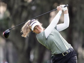 Brooke Henderson hits a shot from the ninth tee during the final round of the LPGA Hilton Grand Vacations Tournament of Champions on Sunday, Jan. 22, 2023, in Orlando, Fla. Henderson went on to win the event, the 13th LPGA Tour title of her career.
