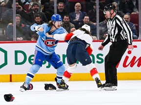 Canadiens left wing Michael Pezzetta (55) fights with Florida Panthers left wing Ryan Lomberg (94) during the third period at Bell Centre in Montreal on Jan. 19, 2023.