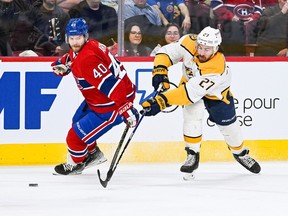 Nashville Predators defenseman Ryan McDonagh (27) plays the puck as Montreal Canadiens right wing Joel Armia (40) defends during first-period action at Bell Centre in Montreal on Jan. 12, 2023.