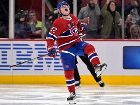 Canadiens' Cole Caufield (22) celebrates after scoring a goal against the St. Louis Blues during the third period at the Bell Centre   in Montreal on Saturday, Jan. 7, 2023.