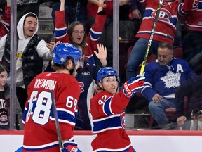 Montreal Canadiens forward Rem Pitlick (32) celebrates after scoring the winning goal against the Toronto Maple Leafs during the overtime period at the Bell Centre. Mandatory Credit: Eric Bolte-USA TODAY Sports
