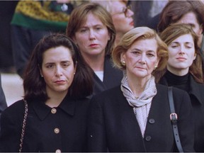 The family of Robert Bourassa at his state funeral in Montreal in 1996. Andrée Simard, right, walked with her daughter Michelle Bourassa, left.