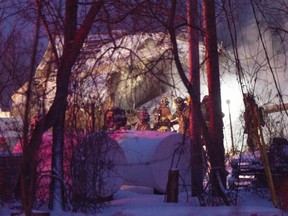 Firefighters work the scene after an explosion at a propane company, on Jan. 12, 2023  in St-Roch-de-L'Achigan.