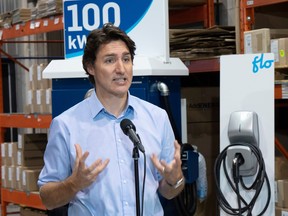 Prime Minister Justin Trudeau speaks to the media after a visit to FLO, a maker of electric car chargers, in Shawinigan, Wednesday, Jan. 18, 2023.