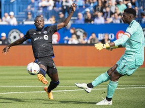 CF Montréal forward Kei Kamara (23) moves in on New York City goalkeeper Sean Johnson (1) during first half Eastern Conference semifinals MLS playoff soccer action in Montreal, Sunday, Oct. 23, 2022. Montreal's busy off-season continued Friday, as Kamara reported to the club for the first time since his recent public trade request.