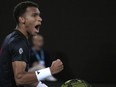 Felix Auger-Aliassime reacts during his second round match against Alex Molcan at the Australian Open in Melbourne, Australia, Wednesday, Jan. 18, 2023.