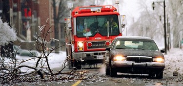 Dodging fallen branches and other debris in Lachine on Jan. 6, 1998.